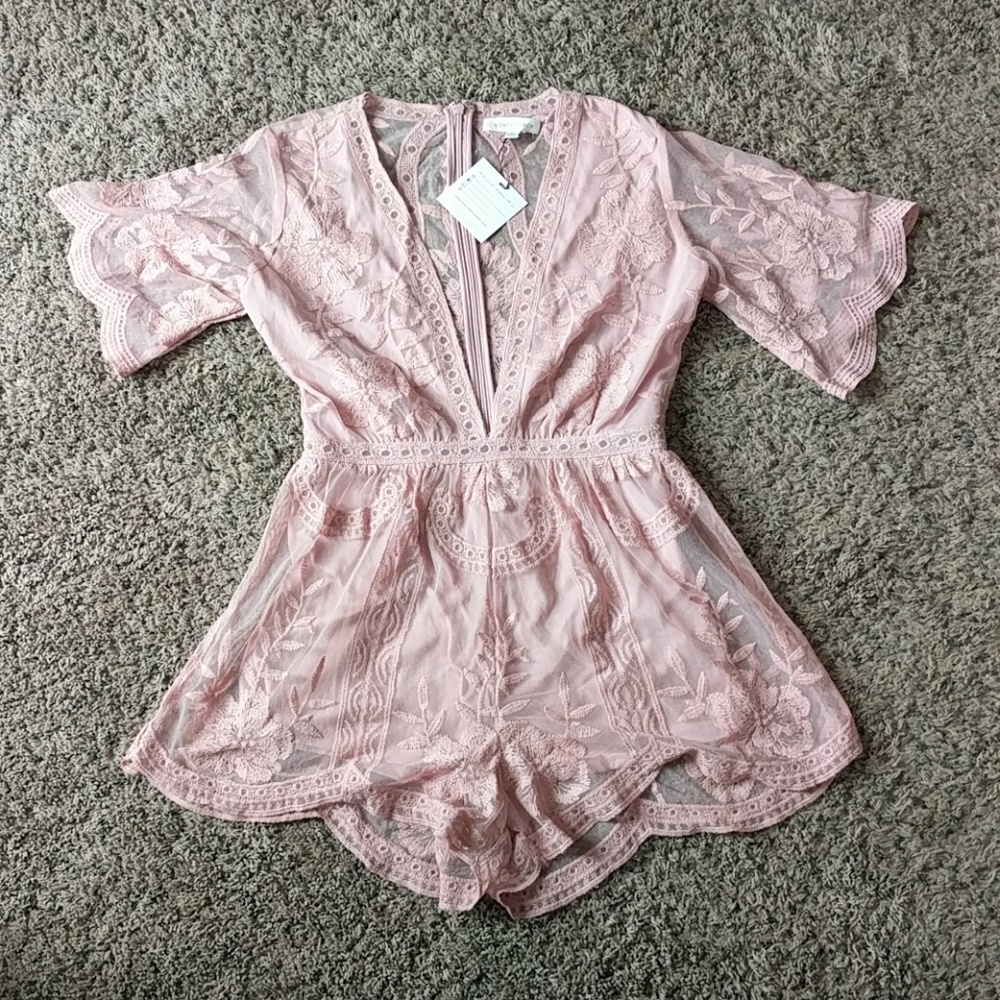 ADORABLE deep v neck romper!